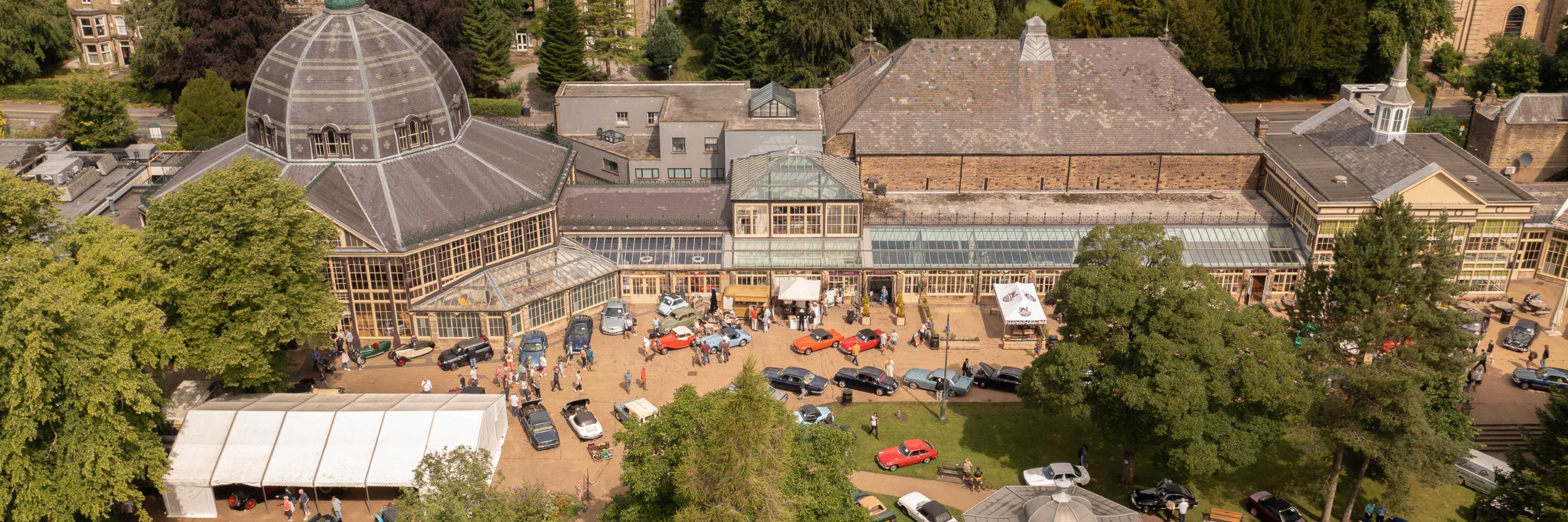 Classic Cars parked outside The Pavilion Gardens in Buxton